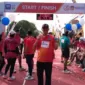 Kasmaji, S.Pd., Kepala Sekolah SMPN 6 Trenggalek, usai menyelesaikan finish Bhayangkara Run.